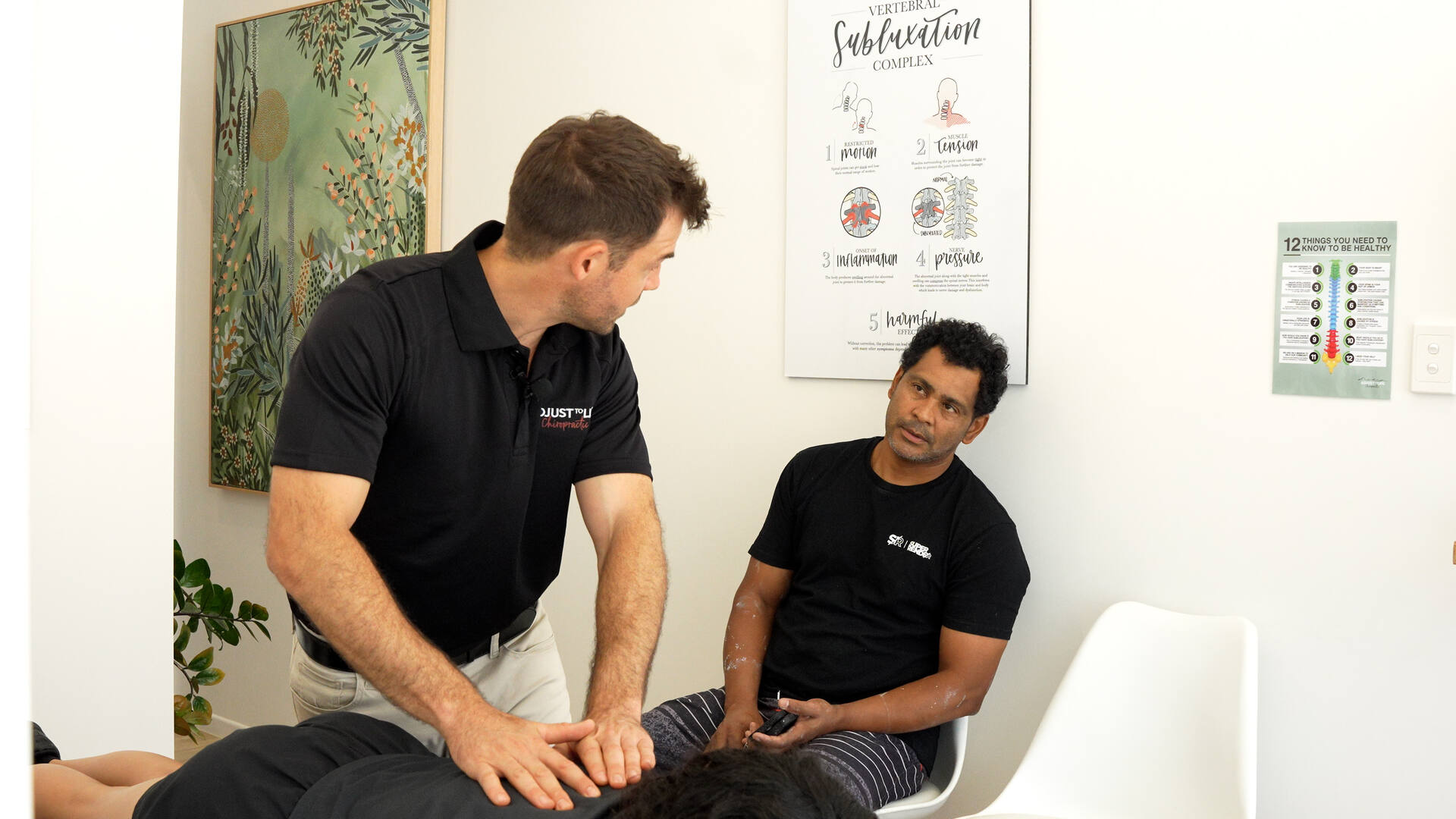 Chiropractor in consultation with a patient